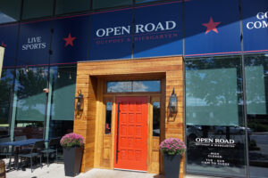 Open Road Outpost sports bar at The Boro Tysons with TVs and bar seating